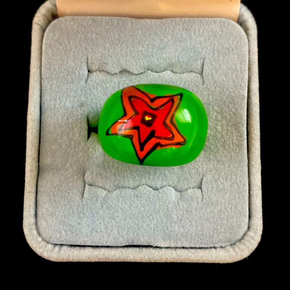 A green lucite ring.